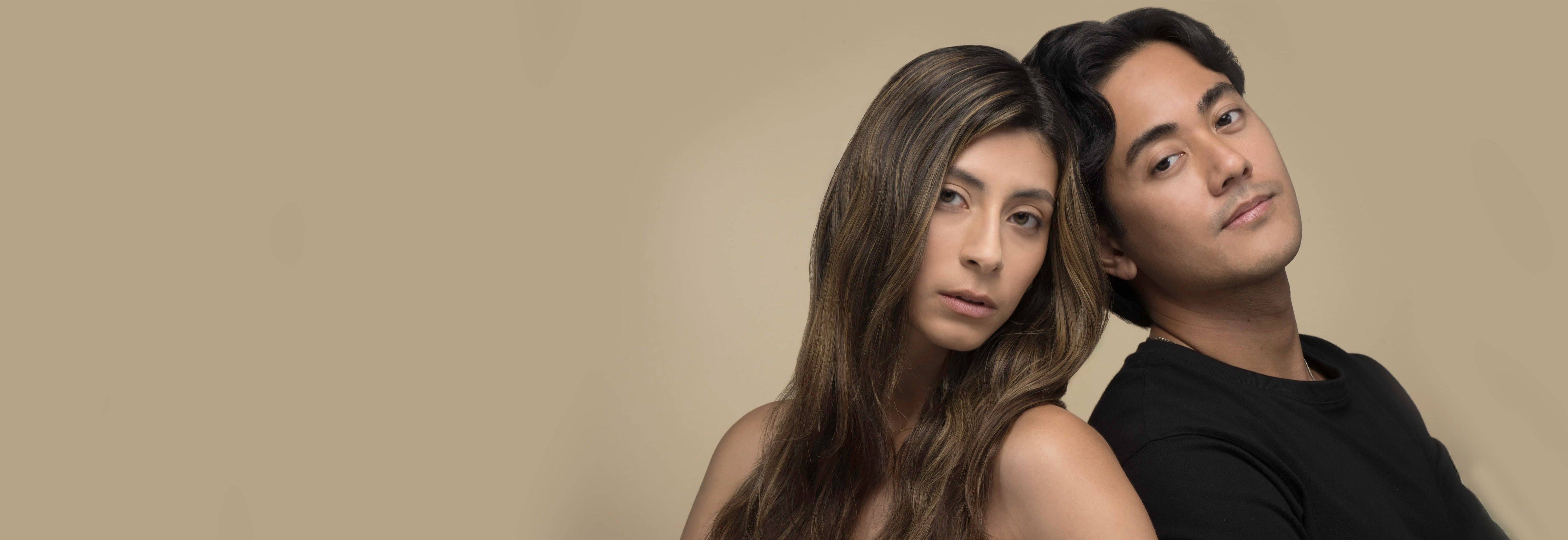 Man and woman with heads back-to-back