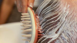 Perosn_getting_hair_and_scalp_cleaned